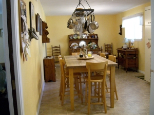 Our kitchen in Texas easily accommodated our big work table and my parents dining room set.